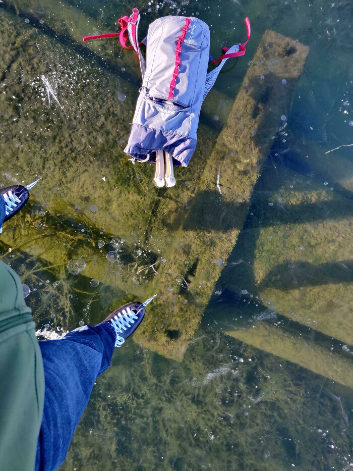 A Lake Drainage Pipe Under Thin Glass Ice, And Six Feet Of Water