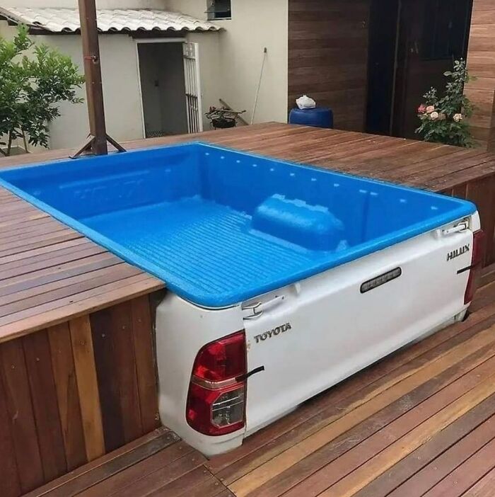 A truck bed converted into a hot tub, showcasing creative disregard for safety regulations.
