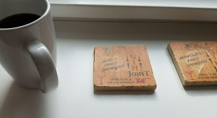 Husband Puts His Coffee Mug Next To 2 Empty Coasters