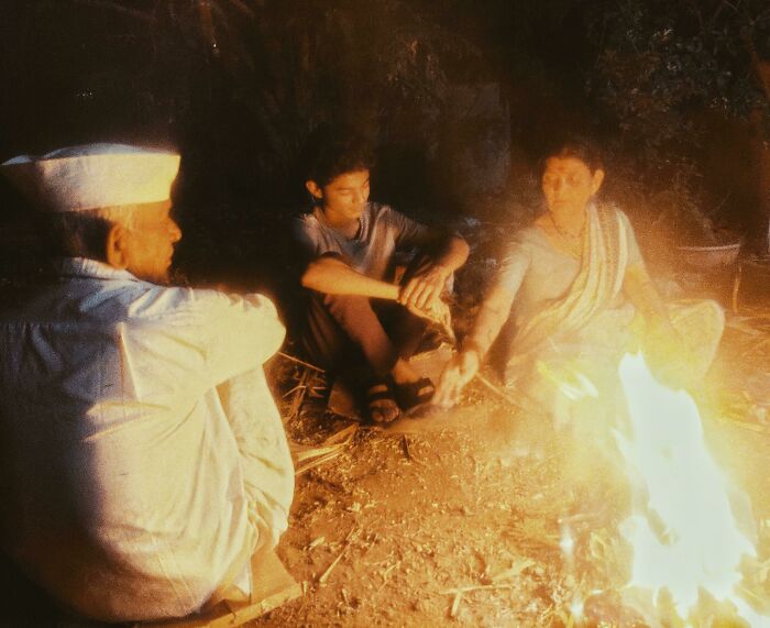 My Grandparents And Brother Besides A Bonfire
