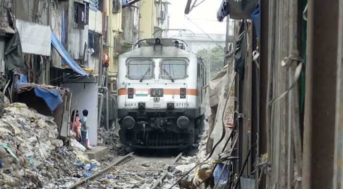 A Train Engine Passing Through The Bandra Station Tracks Of Mumbai, India
