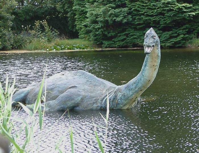 Realistic imitation of Loch Ness Monster in a lake 