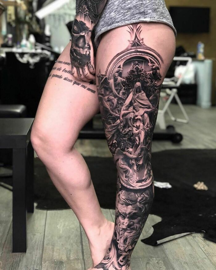 Intricate leg tattoo design featuring detailed artistic elements.