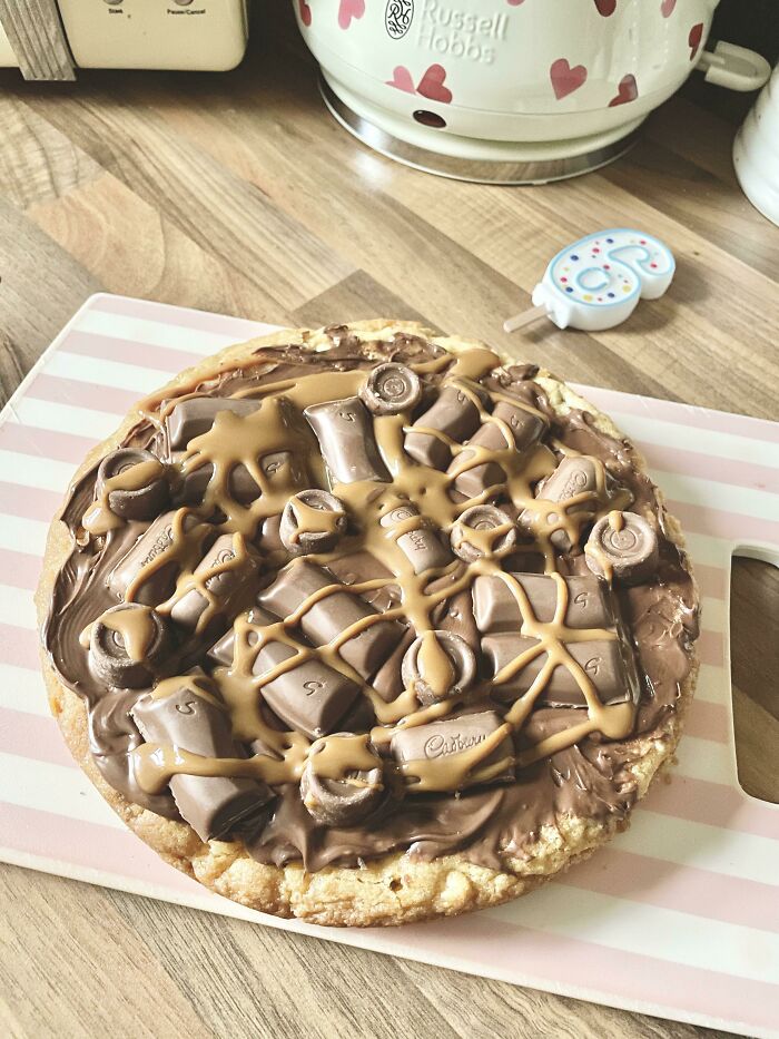 My Son Turns 6 Tomorrow And This Is What He Requested As His ‘Cake’… All Caramel Everything On A Giant Chocolate Chip Cookie. I Hope He Loves It