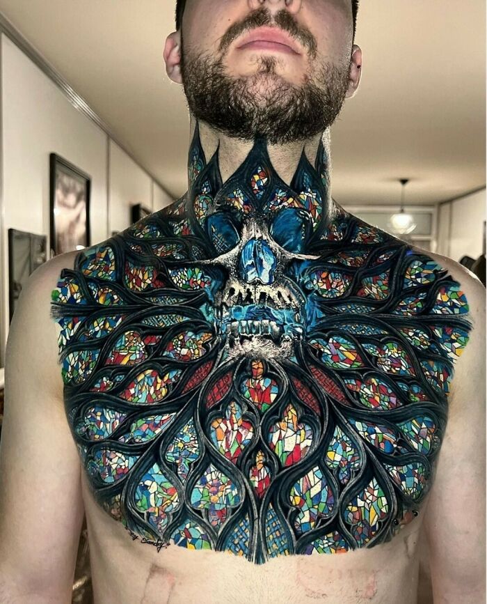 Intricate chest tattoo design resembling stained glass, showcasing one of the best creative tattoos shared online.
