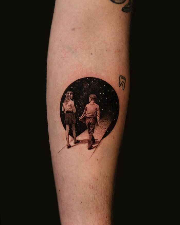 Creative tattoo design of a couple walking under stars on forearm.