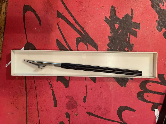 Long Tool With A Metal Dial On The Top That You Can Twist. Possibly Related To Calligraphy Or Type Setting