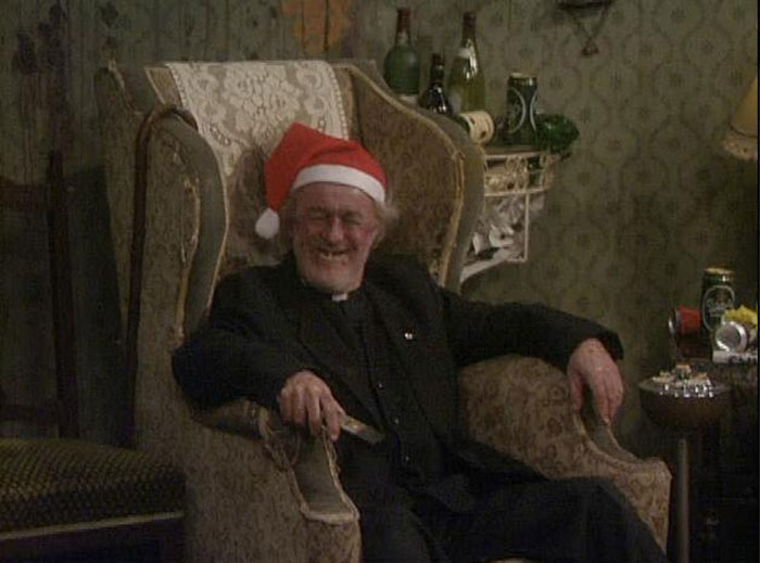 Man wearing Santa's cap sitting in the chair 