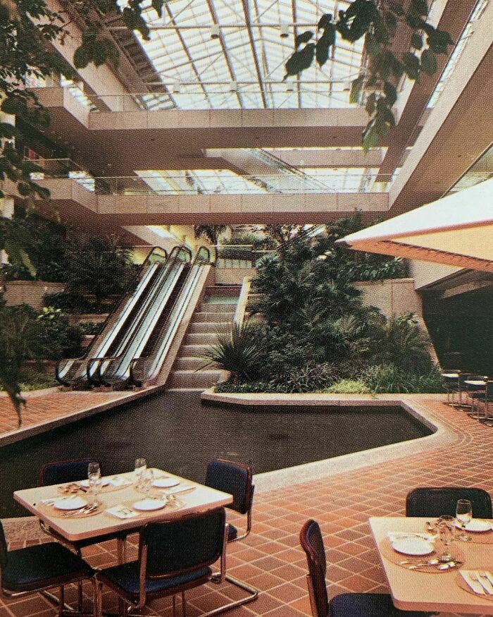 When Your Office Building Has A Foyer With A Restaurant, Waterfall With Pond, Skylight And Tropical Planting 🌴 Commercial Interiors International - Grosvenor Press 1986