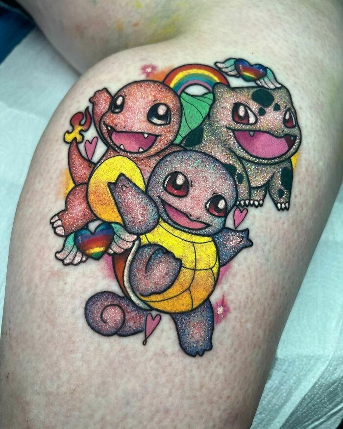 Colorful glitter tattoos featuring cartoon characters on skin, with rainbows and hearts.