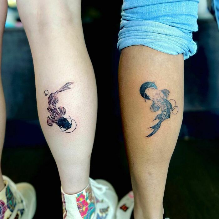 Matching koi fish tattoos on friends' calves symbolize BFF connection.
