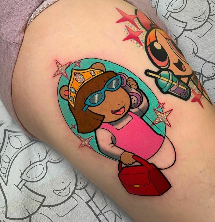 Cartoon tattoo featuring a childhood favorite character in sunglasses and a pink outfit on an arm.