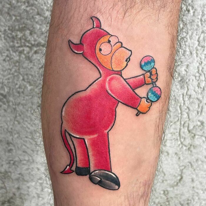 Cartoon tattoo depicting a character in a red costume holding maracas, inspired by animated shows.