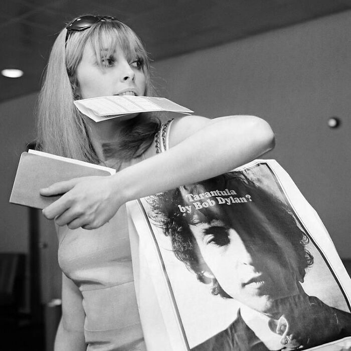 Sharon Tate At Heathrow Airport, London, 1966. The Actress Is Carrying A Bob Dylan Tote Bag Promoting His Then-Upcoming Poetry Book, Tarantula