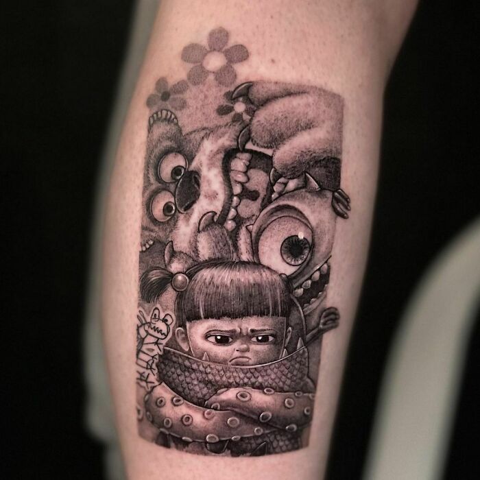 Tattoo of cartoon characters from an animated show, featuring a child with monsters in a detailed black and gray style.