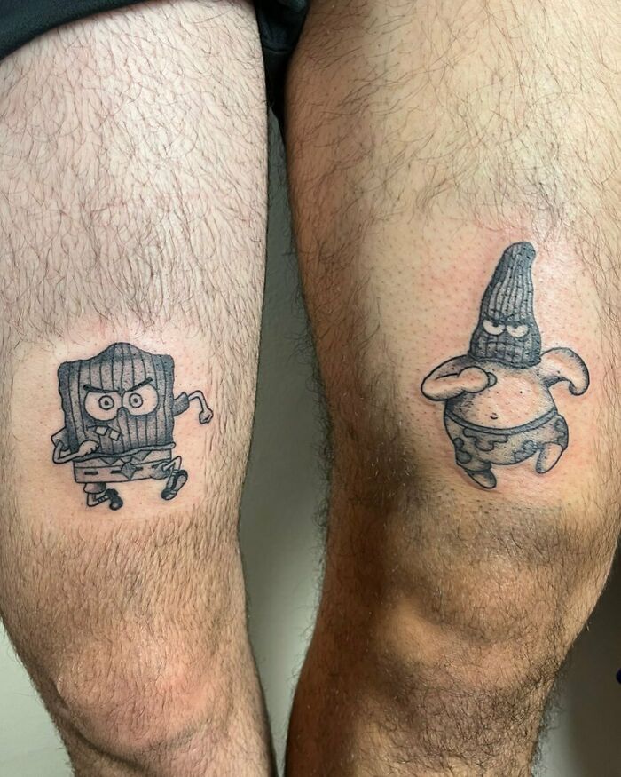 Cartoon-inspired best friend tattoos on legs featuring two masked characters.