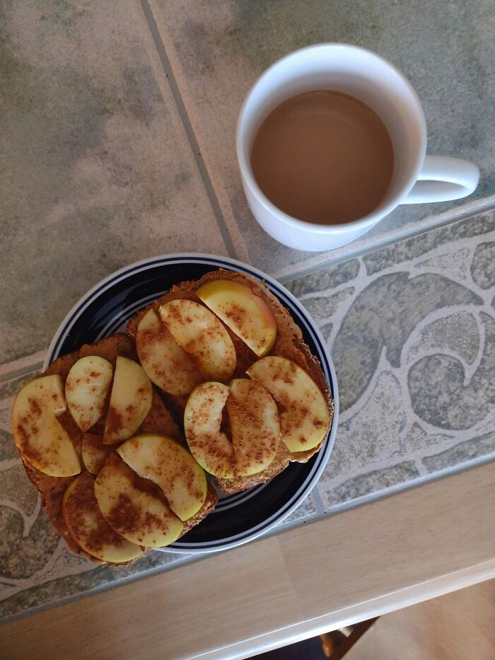 Almond Butter Apple Toast Topped With Honey And Cinnamon, And Pumpkin Spice Coffee On The Side