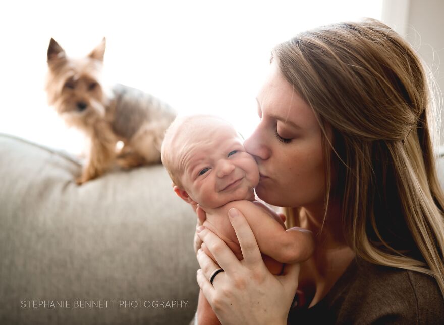 A photograph of a newborn with their mom