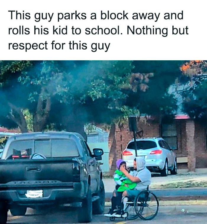 Dad in wheelchair with child, parked near school, showing dedication and love in fatherhood.