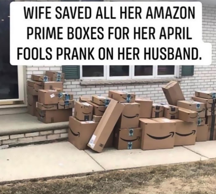Piles of Amazon boxes on a porch, part of an April Fools prank related to fatherhood humor.
