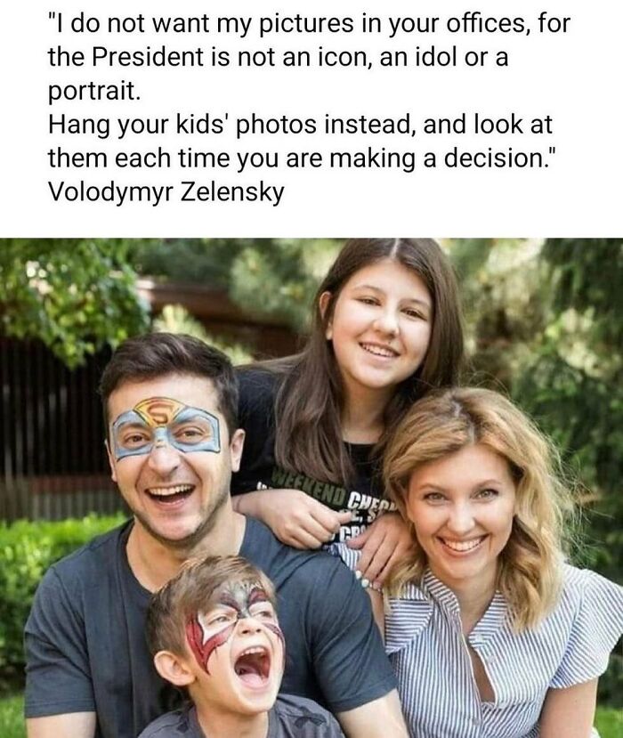 Fatherhood captured in a joyful family moment; a dad with face paint and kids smiling in a playful scene.