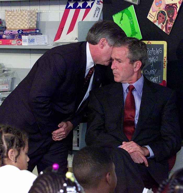 President George W. Bush Is Interrupted By Chief Of Staff Andrew Card While Reading To Schoolchildren In Sarasota, Florida, On September 11th, 2001