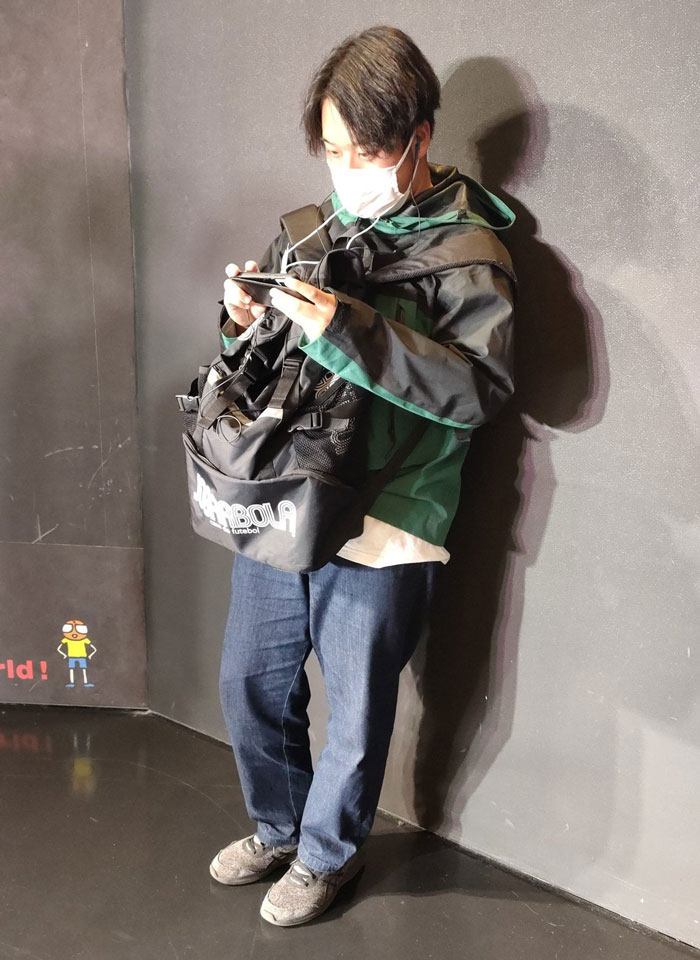 That Mildly Annoying Person Wearing A Huge Backpack And Playing A Game On A Smartphone On A Jam-Packed Train