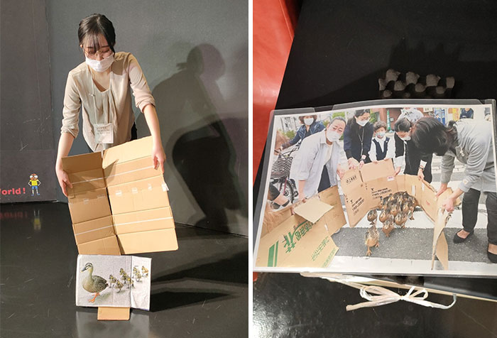 Person in costume mimicking ducks using cardboard, inspired by Mundane Halloween.