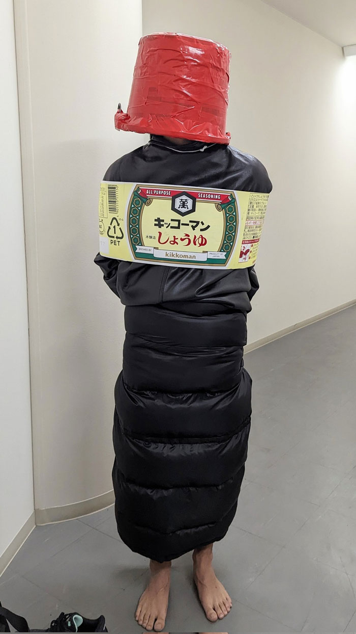 Costume depicting a mundane Halloween outfit as a soy sauce bottle, complete with detailed label and packaging.