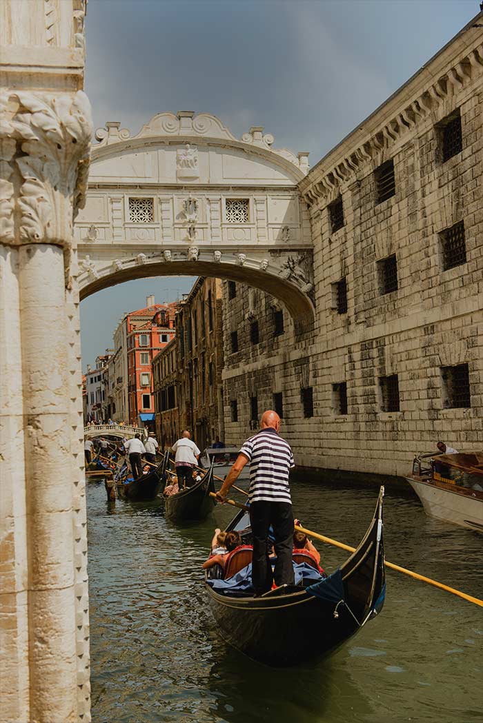 Bridge of Sighs with people swimming in river