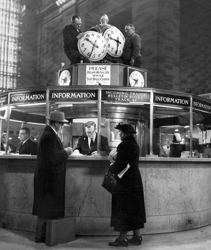 Workers Reinstall Clock At The Information Booth In Grand Central, New York, 1954