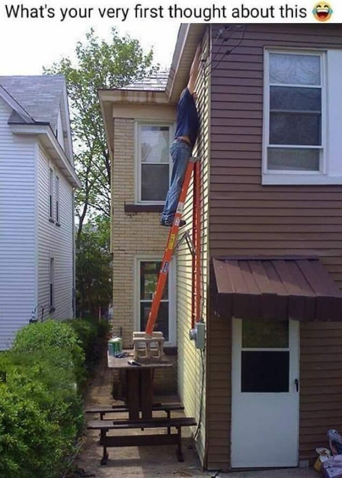Person on unsafe ladder setup, ignoring OSHA safety, reaching for a siding repair.