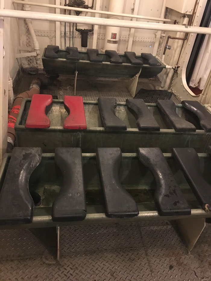 Head (Ship’s Restroom) Of Navy Destroyer Uss Kidd That Sailed From 1943 To 1967. One Seat Is Painted Red: This Was Called The "Hot Seat" And It Was Reserved For Crew Who Had Sexually Transmitted Diseases