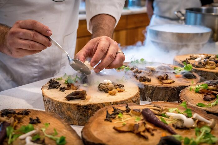 Kitchen Chef Preparing Fancy Dinner On Wood 
