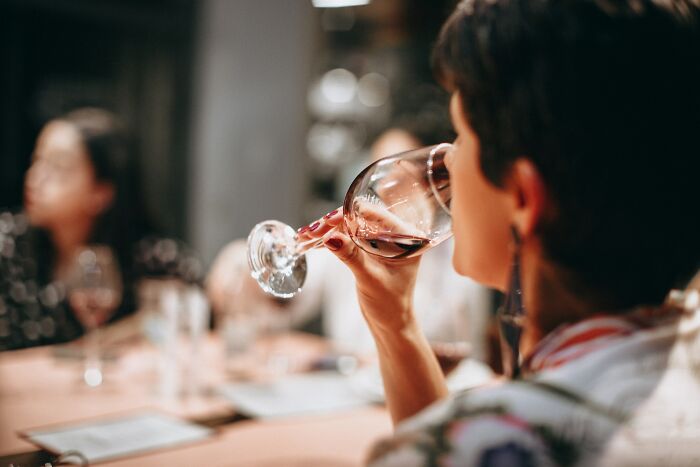 Woman In A Wine Testing Drinking Wine 