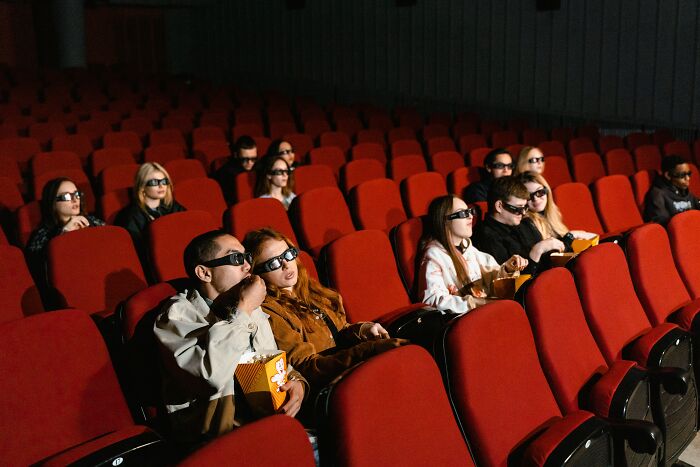 People Watching Movie In Cinema 