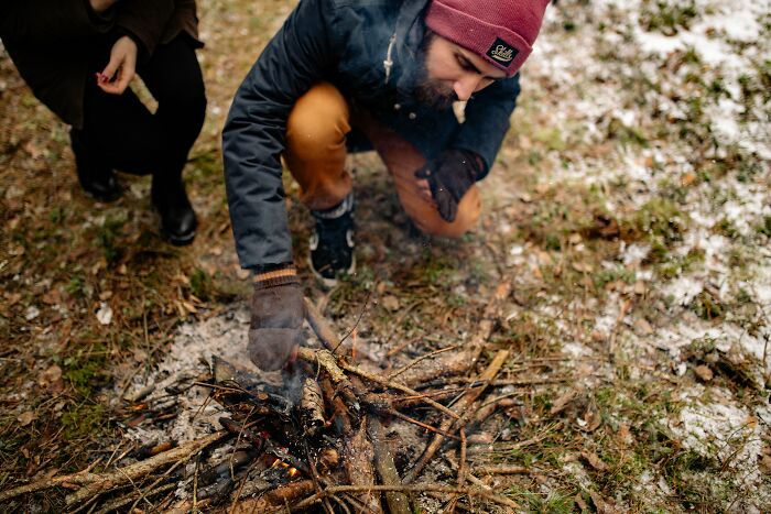 Man Starting A Fire In The Middle Of The Forrest 