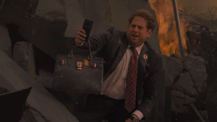 Man taking a picture at building ruins