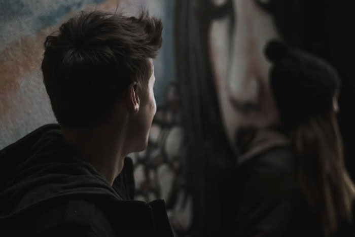 Man looking at woman