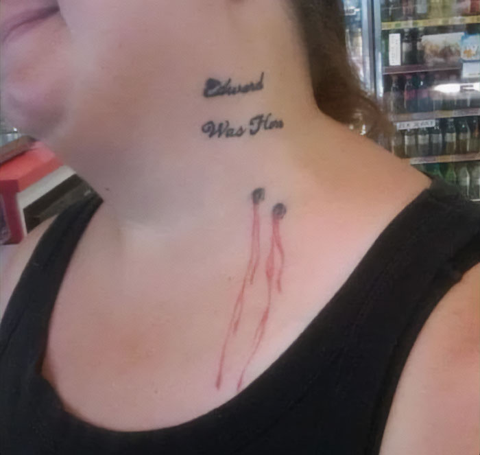 Tattoo with text and abstract design on a person's neck, part of bad tattoo collection.