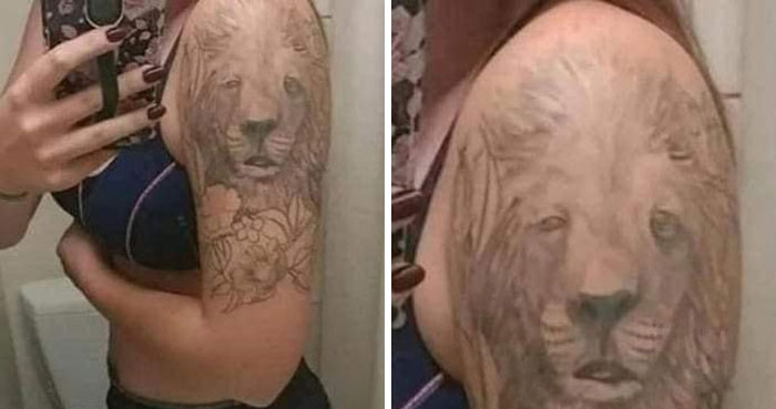 A person shows a large lion tattoo on their arm, highlighting bad tattoo quality.