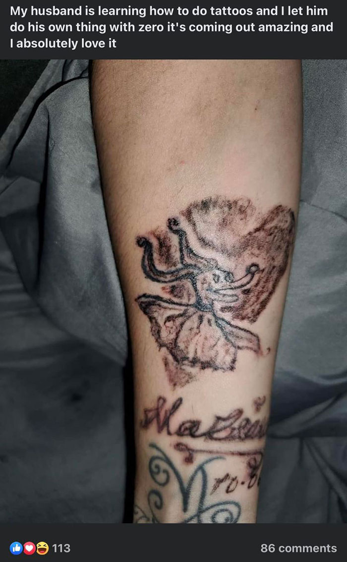 Amateur tattoos on a forearm with abstract design and text.