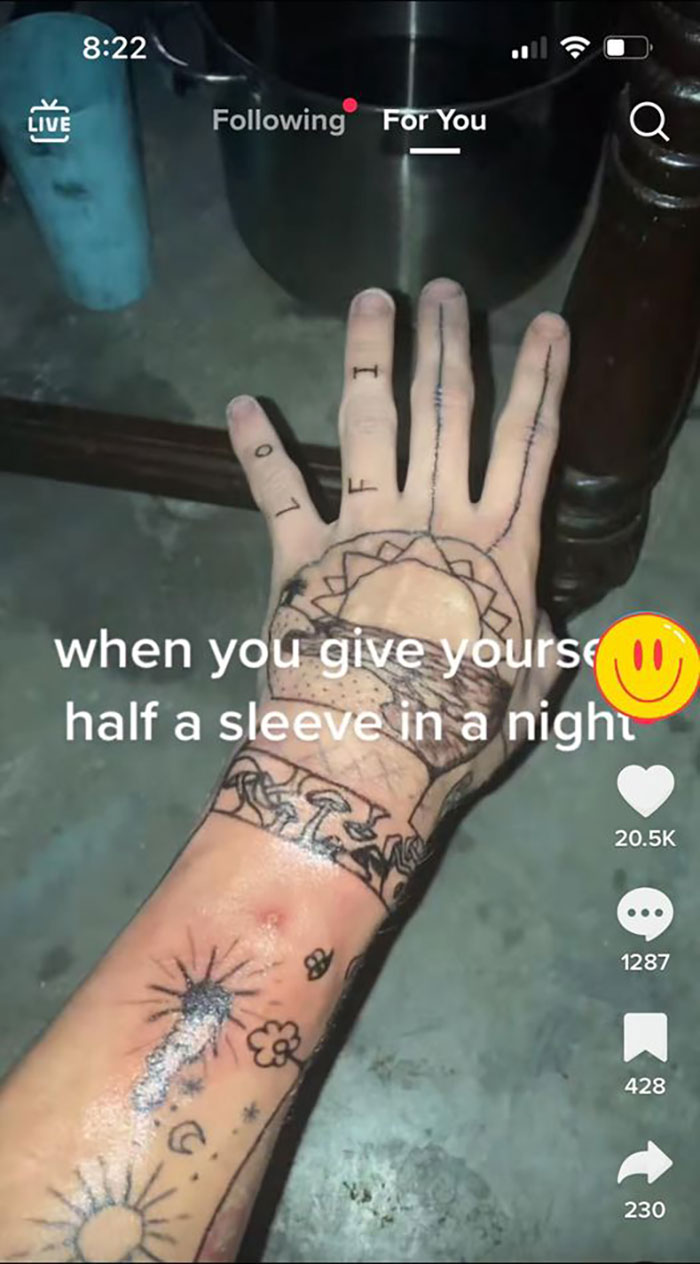 Hand with poorly done tattoos, featuring stars and mushrooms, shared on a social media group highlighting bad tattoos.