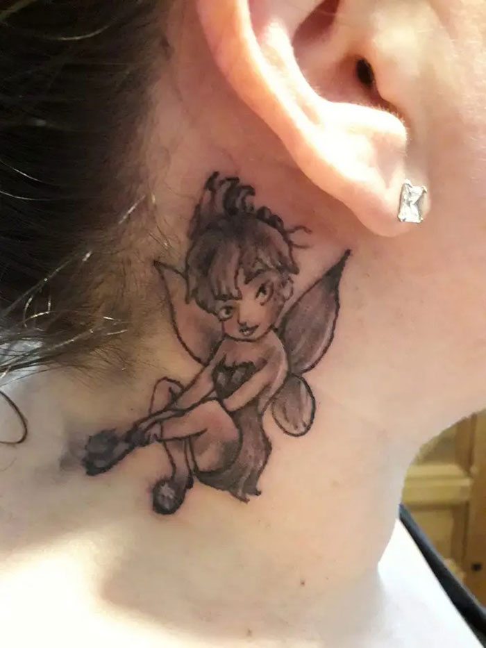 Poorly done tattoo of a cartoon fairy on a person's neck, showcasing bad tattoos shared on social media.