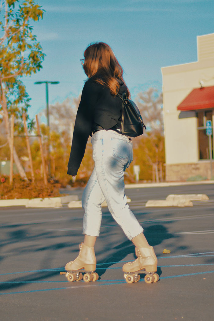 Person rollerblading solo outdoors, embracing "me time."