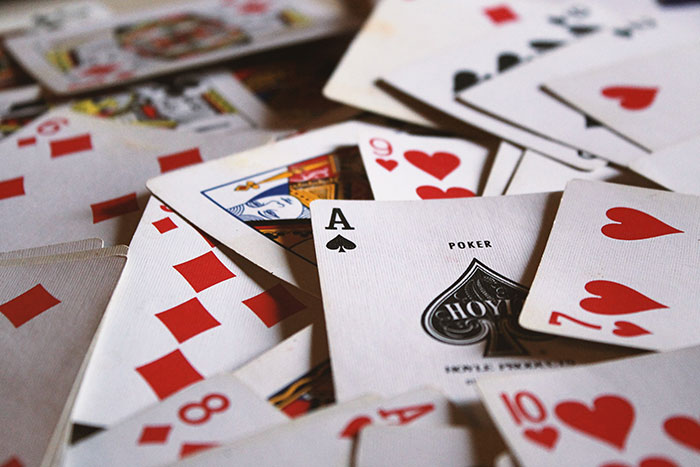 Playing cards scattered, ideal for solo activities and enjoying me time.