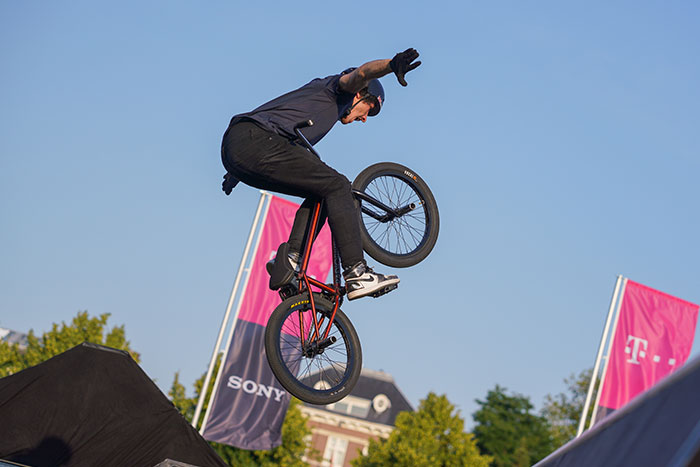 Person performing solo tricks on bike outdoors, showcasing exciting ways to enjoy "me time."