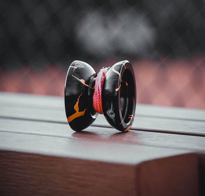 Yo-Yo on a wooden table, perfect for solo playtime and enjoying some quality "me time".