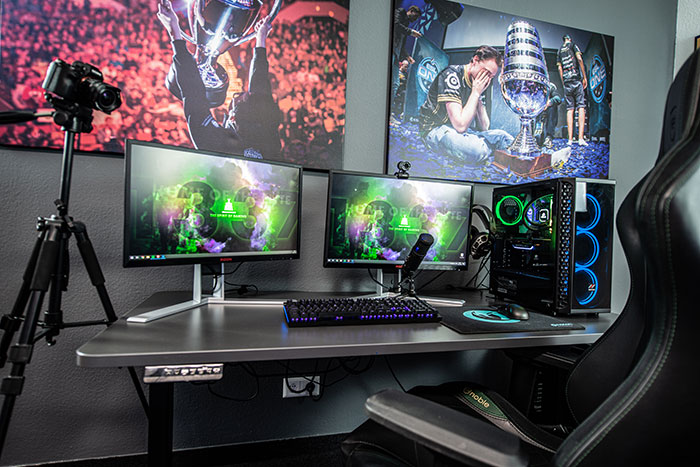 Gaming setup for solo enjoyment, featuring dual monitors, PC, and gaming chair.
