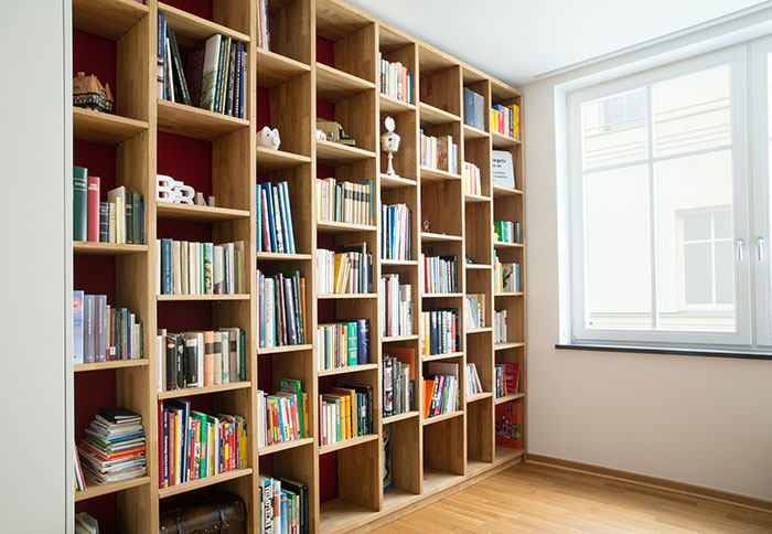 Bookshelf filled with books, perfect for enjoying "me time" and exploring new ideas alone.